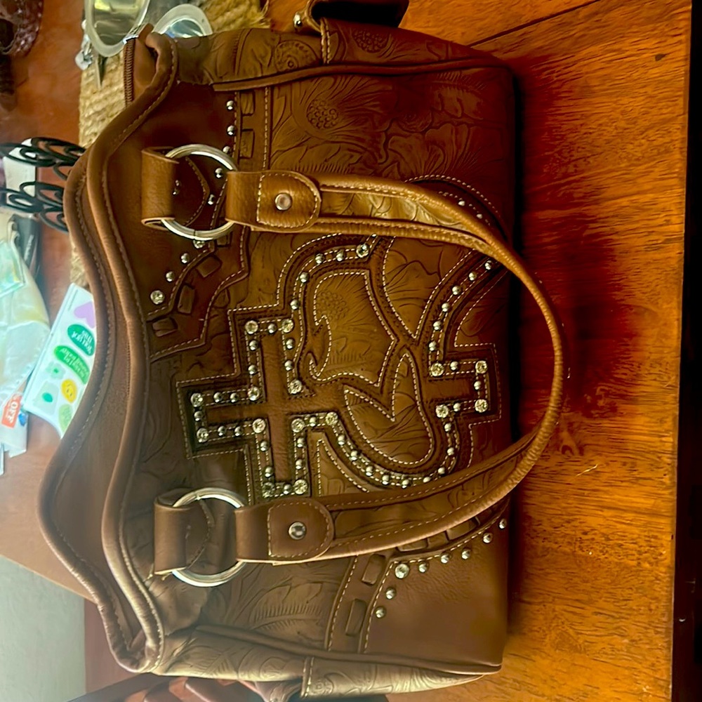 never been used before brand new purse! I got it at a private boutique